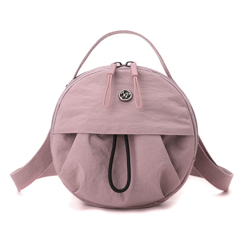 Crayon pink Fashionable Round Crossbody Bag with Water-Resistant Nylon and Multi-Pocket Design for Daily Travel Lightweight Hands-Free Storage Solution for Local Professionals